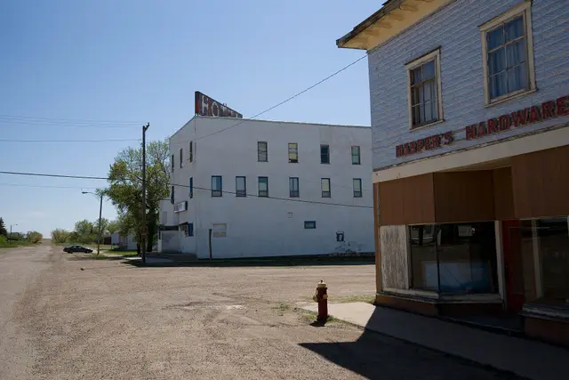 Hotel and Harper's Hardware on a gravel street