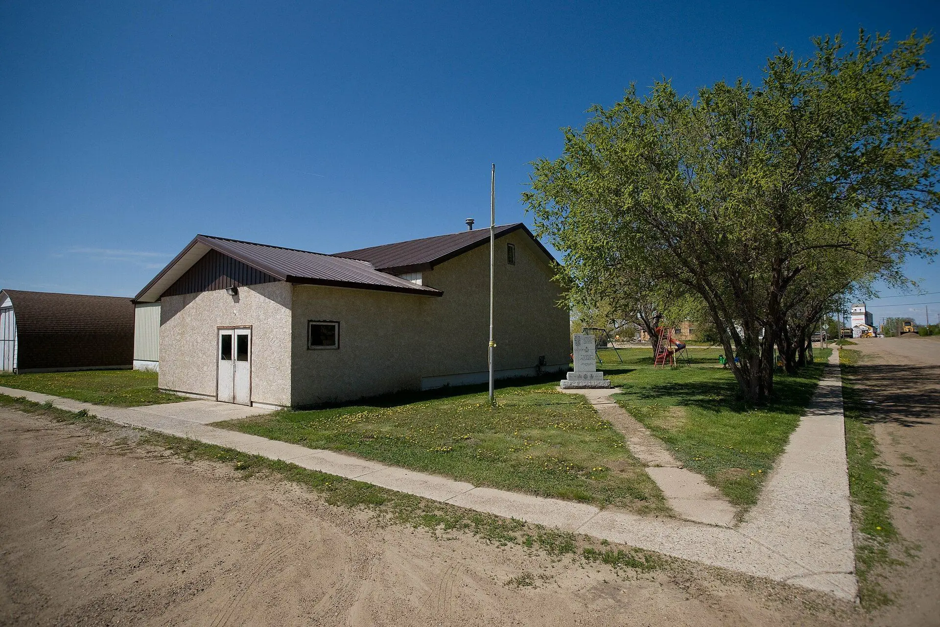 Community hall and memorial on a village street